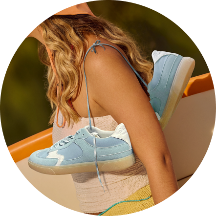 Casual sneakers styled on a bright background